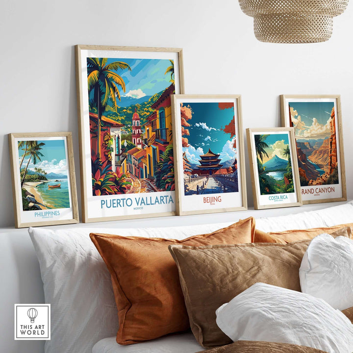 Puerto Vallarta travel print displayed with other travel art prints on a white shelf in a modern room.