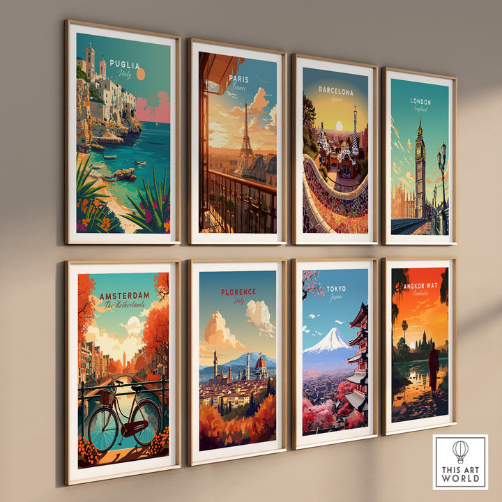 Wall display of travel poster prints featuring Puglia, Paris, Barcelona, London, Amsterdam, Florence, Tokyo, and Bangkok.