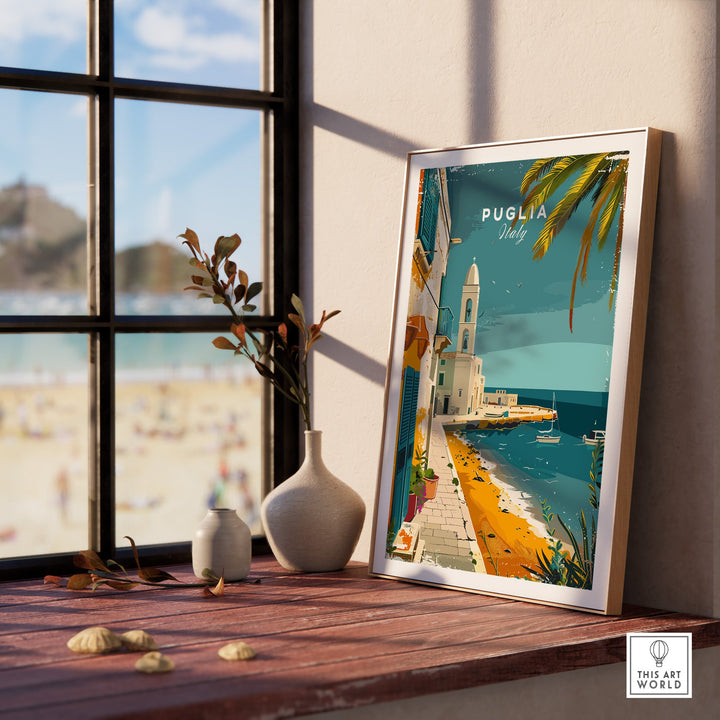 Puglia Wall Art Print - Italy Travel Poster displayed on a windowsill with beach view in background