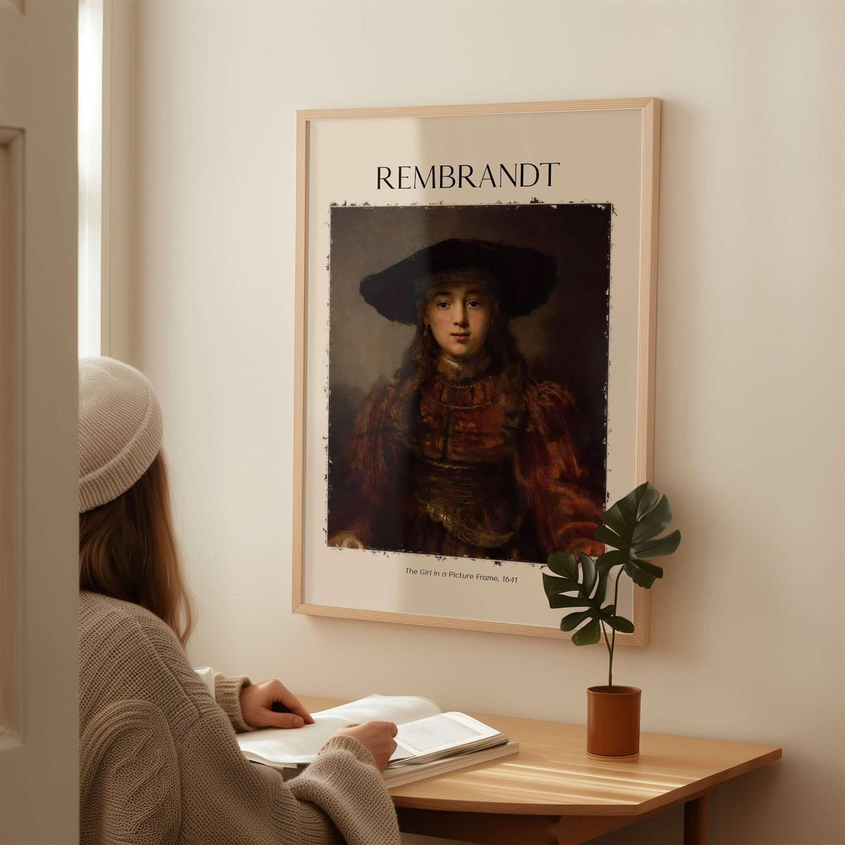 Rembrandt Girl Picture Frame 1641 Portrait Art Print Dutch Golden Age Poster Decor displayed on wall with person studying.
