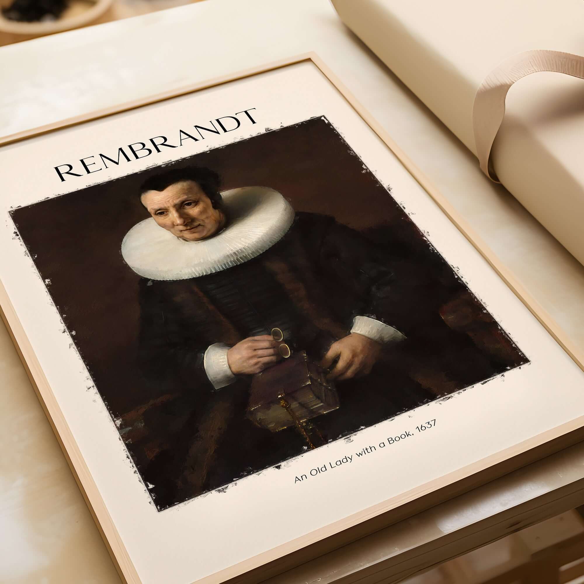 Rembrandt Old Lady with Book 1637 Portrait Print Dutch Golden Age Poster Art displayed on a table.