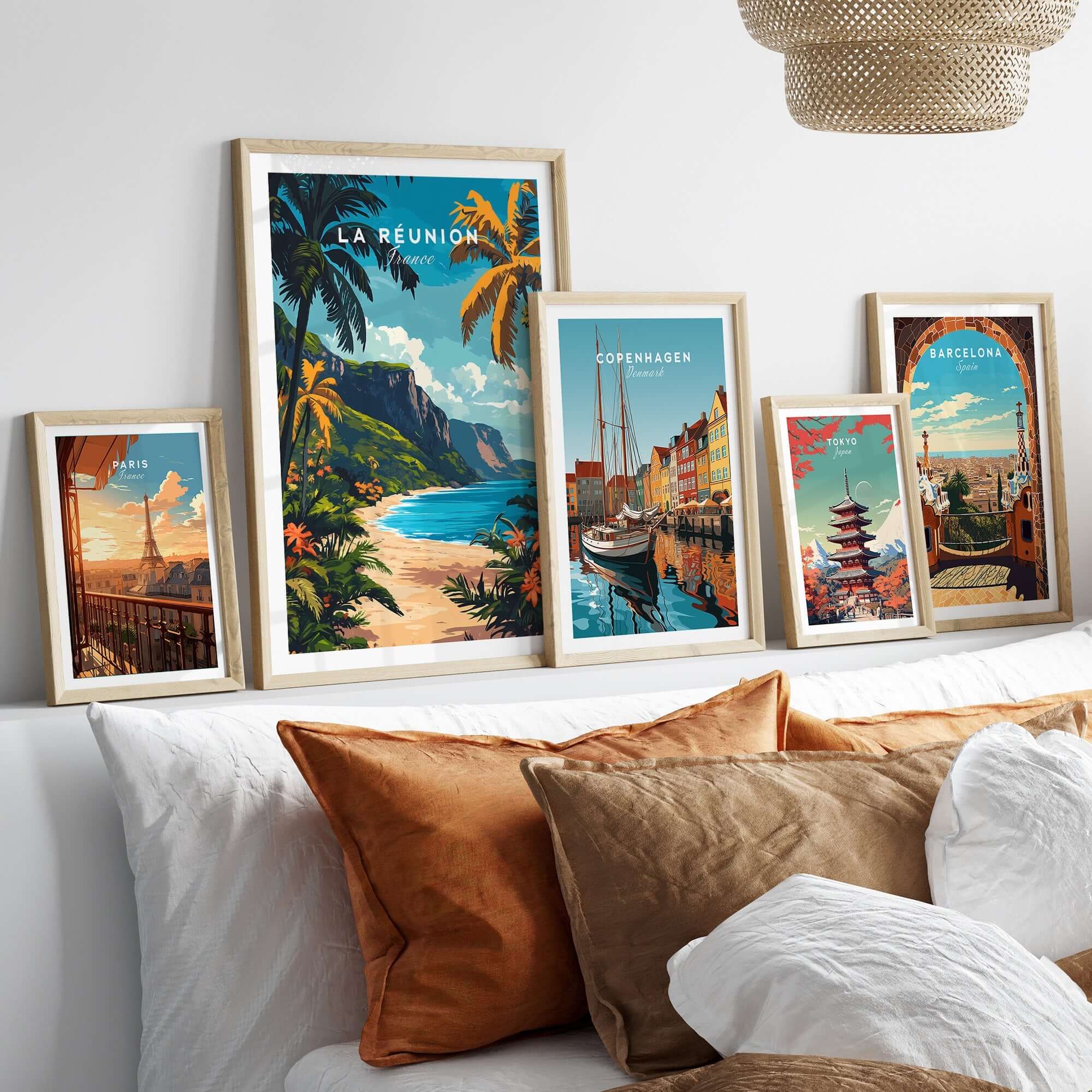 Réunion Island Travel Print collection showcased on a cozy couch with decorative pillows and framed wall art.