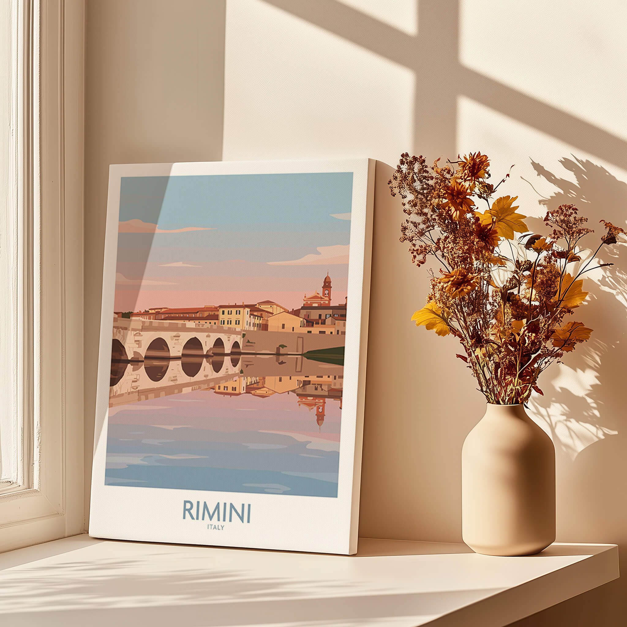Rimini Italy Poster | Panoramic River Cityscape Scene Canvas Print displayed beside a vase with flowers and sunlight.