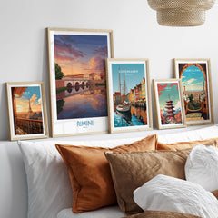 Rimini Italy Poster | Romantic Italian Town River View Canvas Print displayed among other city posters on a cozy sofa.