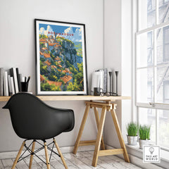 Rocamadour Travel Poster displayed on a desk in a bright room, showcasing France's scenic charm and vibrant landscapes.