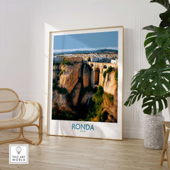 Ronda Spain Poster | Stunning Gorge Landscape Scene Canvas Print displayed in modern interior with plant and chair.