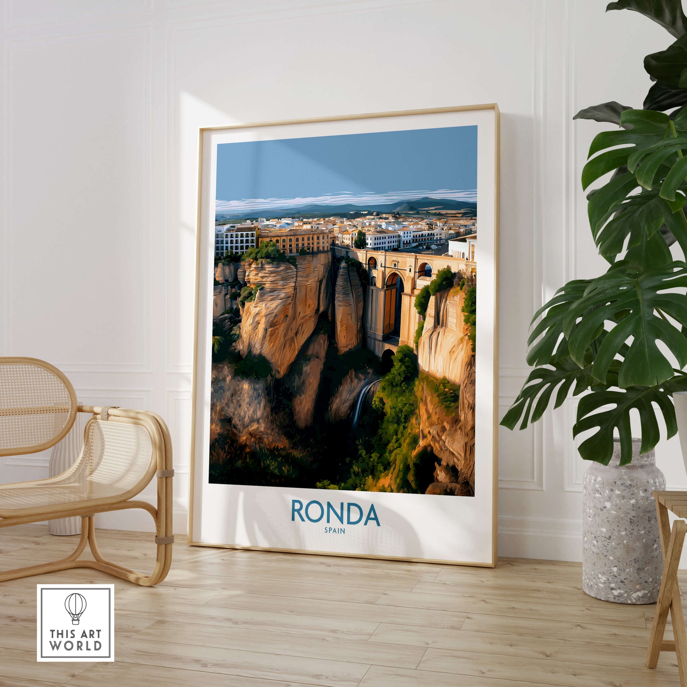 Ronda Spain Poster | Stunning Gorge Landscape Scene Canvas Print displayed in modern interior with plant and chair.