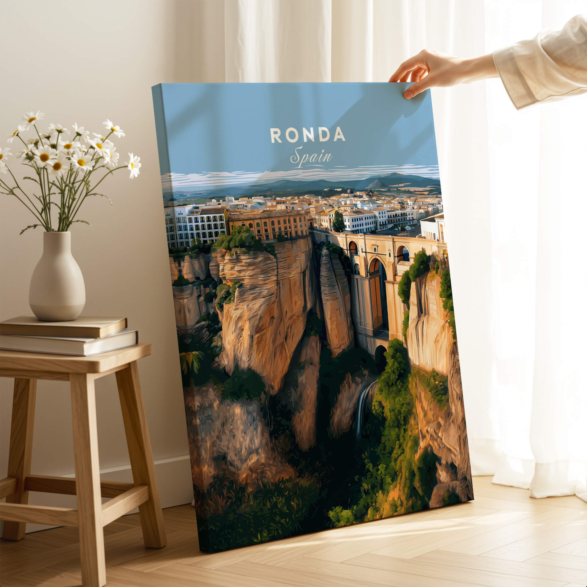 Ronda Spain Wall Art Print | Panoramic Andalusian Cityscape Travel Poster displayed on a table with a vase of flowers.
