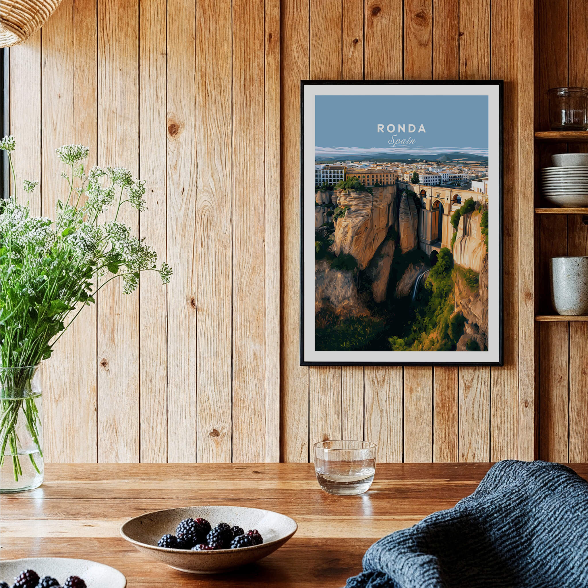 Ronda Spain Wall Art Print | Panoramic Andalusian Cityscape Travel Poster displayed in a cozy wooden interior with plants.