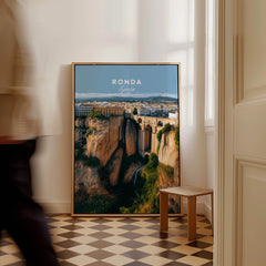 Ronda Spain Wall Art Print | Panoramic Andalusian Cityscape Travel Poster displayed in a modern interior with checkered floor.
