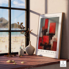 Rothko Style Deep Red Modern Abstraction Print | Contemporary Wall Decor displayed on a table by a window.