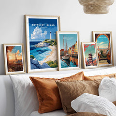 Rottnest Island Poster Australia displayed among other travel posters on a cozy couch with decorative pillows.