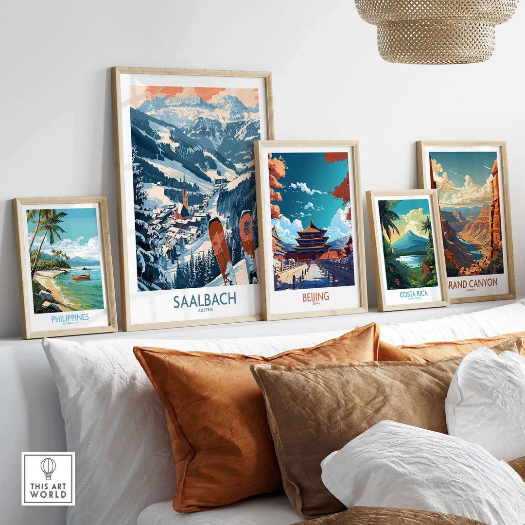 Saalbach ski poster featuring Austrian mountain scenery displayed alongside various travel posters in a stylish living room setting.