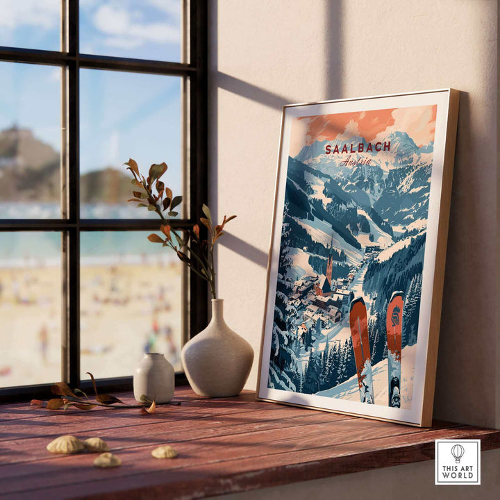 Saalbach Print Austria ski poster displayed on a windowsill, showcasing snowy mountain scenery and ski equipment in an artistic style.