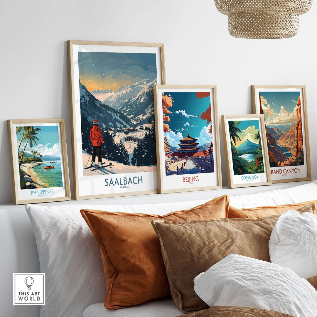 Saalbach ski print alongside travel art from the Philippines, Beijing, Costa Rica, and Grand Canyon displayed on a wall.