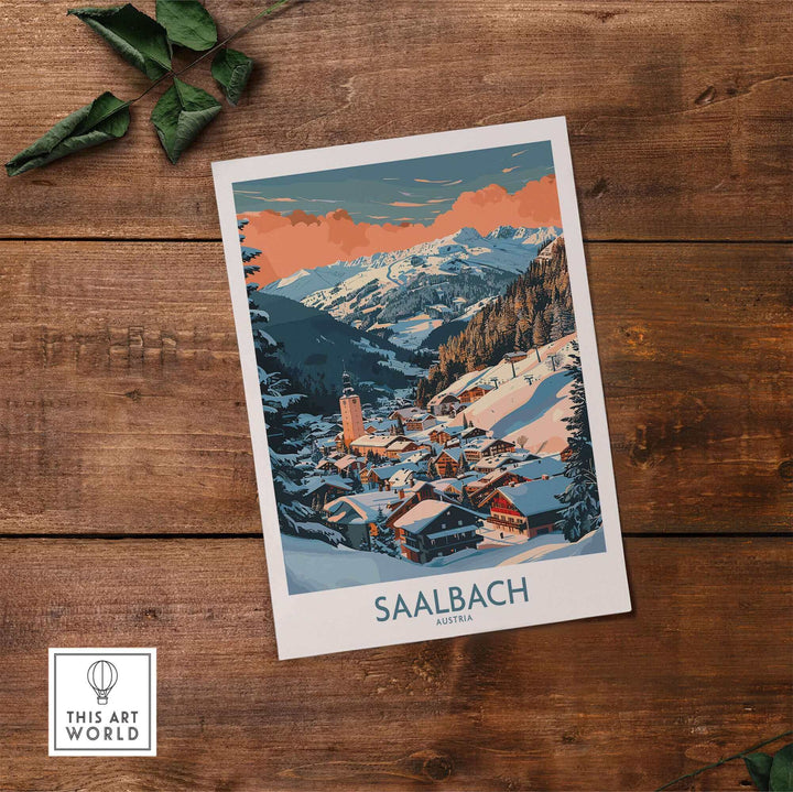 Saalbach Wall Art Ski Poster featuring a picturesque winter mountain village scene in Austria, placed on a rustic wooden table.