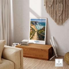 Sagres Poster Portugal Beach Art Print displayed in a cozy living room setting with natural decor.