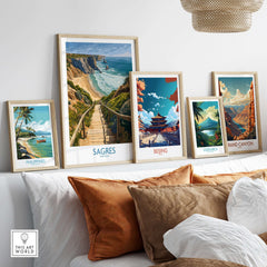 Sagres Poster Portugal Beach Art Print displayed among framed travel posters on a stylish home decor shelf.