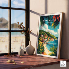Saint Martin Travel Print framed beside a beach view, showcasing vibrant colors and tropical scenes of the island.