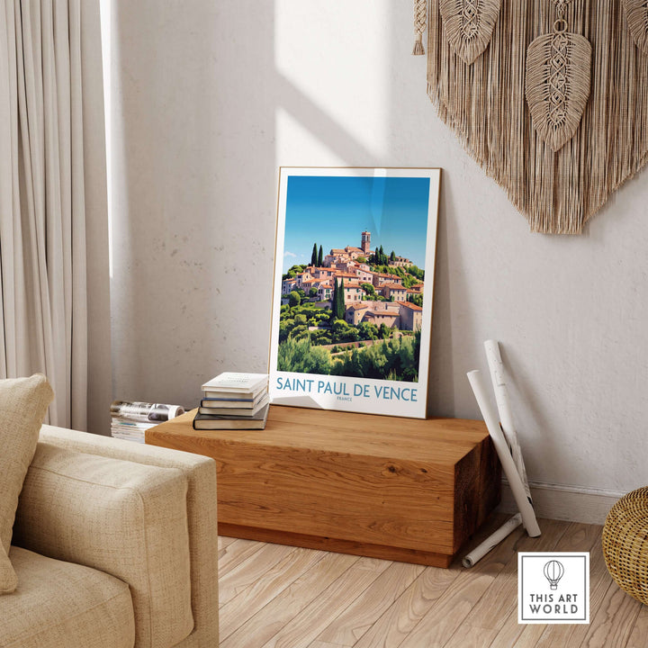 Saint Paul de Vence travel poster displayed in a cozy living room, showcasing the beauty of the French Riviera.