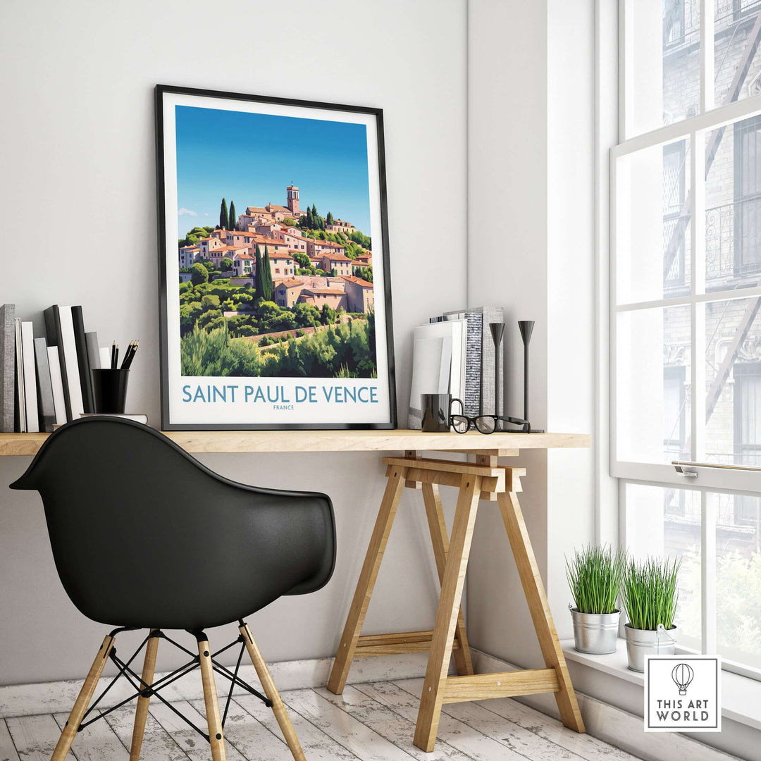 Saint Paul de Vence travel poster displayed in a modern workspace, showcasing the beauty of the French Riviera.