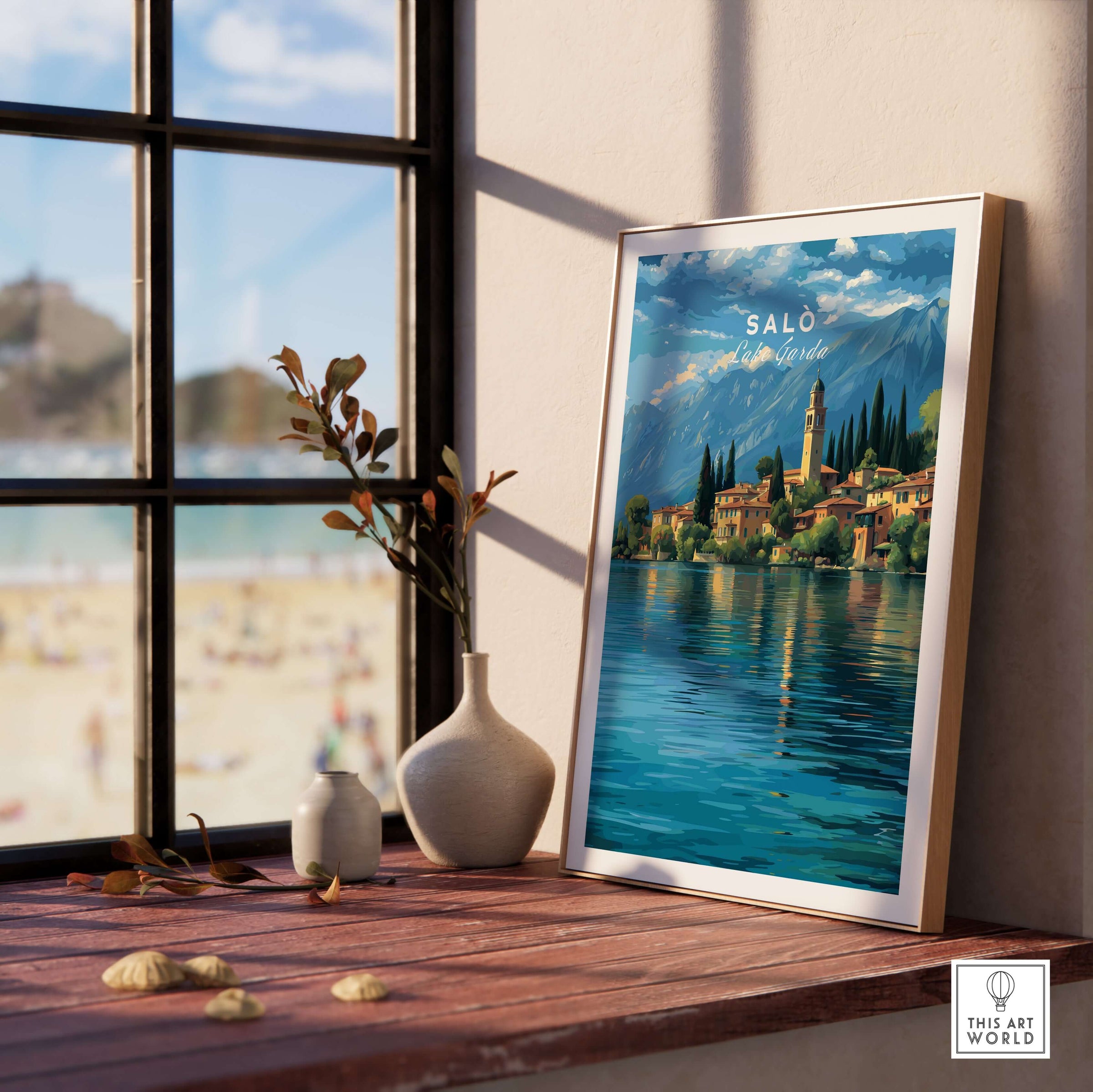 Salò Lake Garda Print | Italian Alps Wall Decor displayed on a wooden shelf by a window, showcasing stunning Italian scenery.