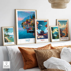 Salò Lake Garda Italy Sunset Art Print | Lakeside Boats Poster displayed among other travel art prints on a cozy couch.