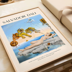 Salvador Dali Dream Caused by the Flight of a Bee Pomegranate Surrealism Art Print Poster Tigers displayed on a table.