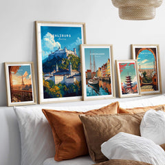 Various framed prints including Salzburg Wall Art prominently displayed on a wall with decorative pillows.