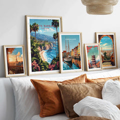 Santa Barbara Travel Print California displayed among other travel art prints on a stylish bed with decorative pillows.
