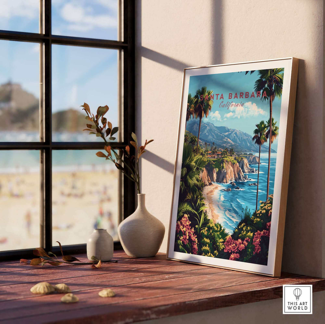 Framed Santa Barbara travel print with vibrant coastline, palm trees, and mountains, styled on a windowsill, perfect ski poster decor.