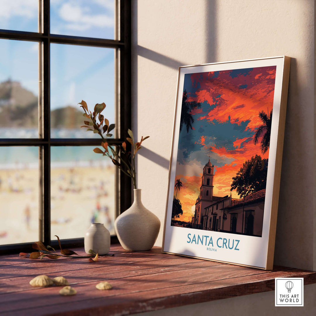 Santa Cruz Bolivia Sunset Art Print | Palm Trees Church Poster displayed on a wooden table near a window.