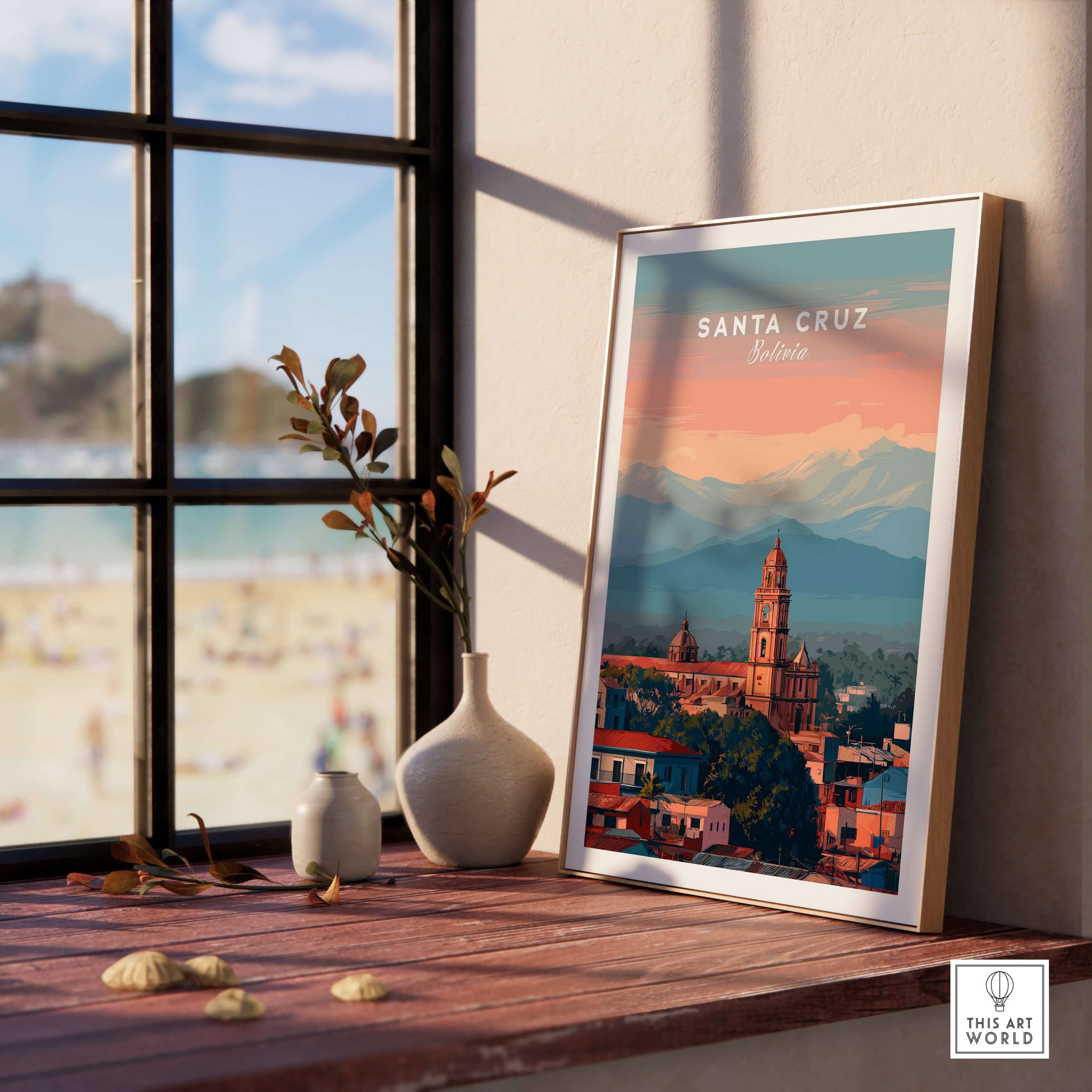 Santa Cruz City Print | Bolivian Home Wall Art displayed on a window sill with a beach view in the background.