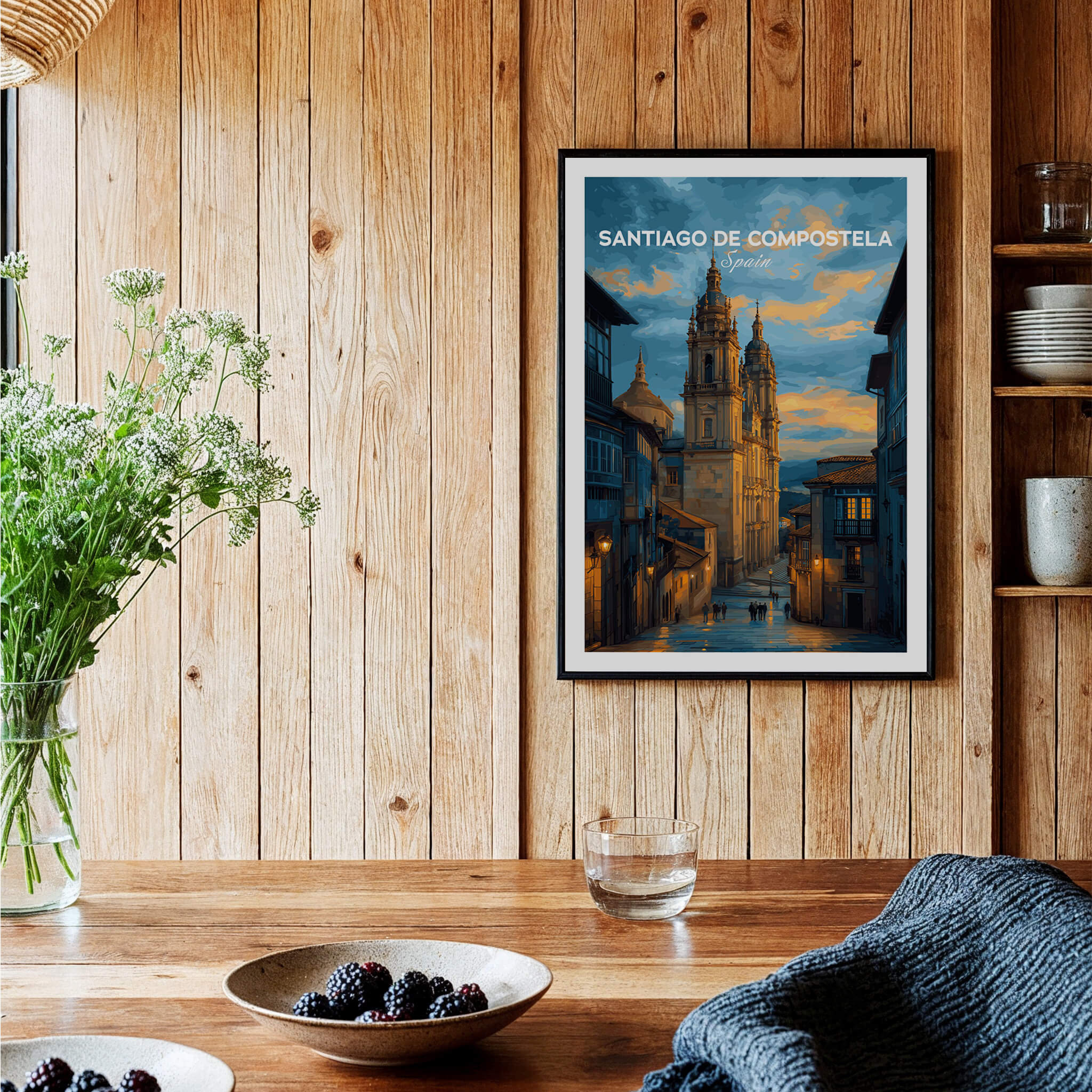 Santiago de Compostela Print | Galician Home Decor showcased in a warm wooden interior with flowers and tableware.