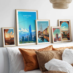 Santiago Travel Poster - Chile displayed in stylish frames on a decorative wall with a cozy bedding setup.
