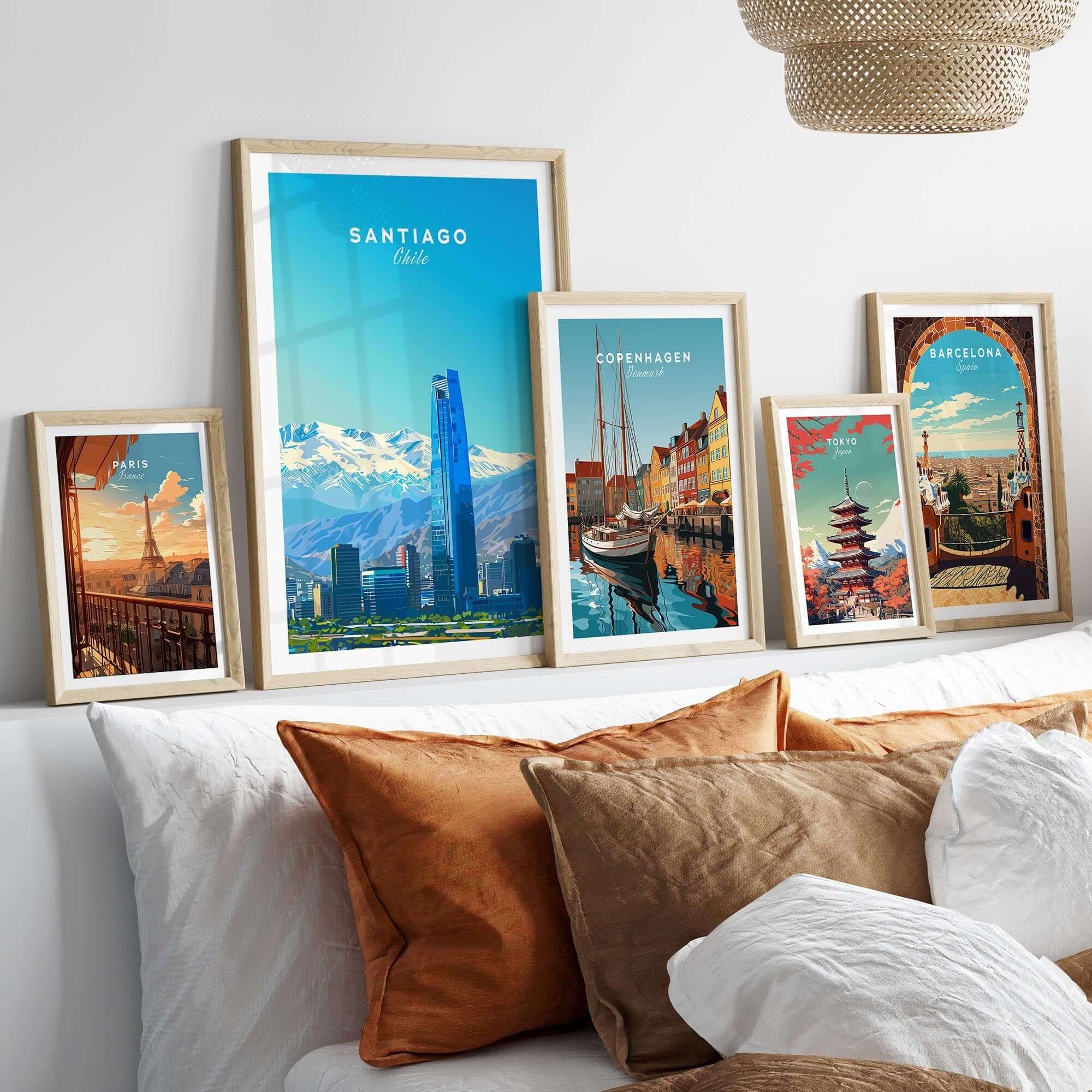 Santiago Travel Poster - Chile displayed in stylish frames on a decorative wall with a cozy bedding setup.