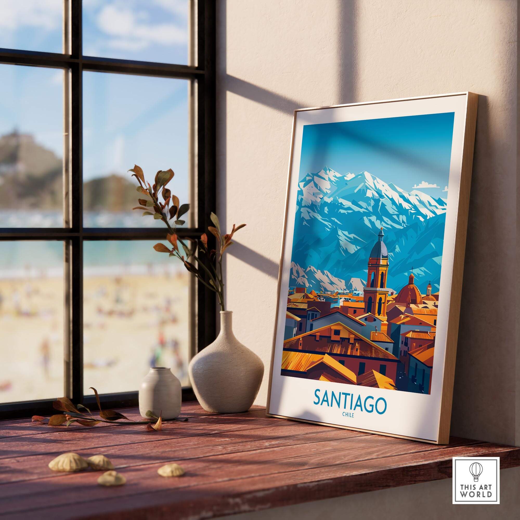 Santiago Wall Art Poster - Chile displayed in a bright room with a view of the beach and mountains in the background.