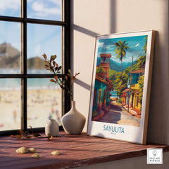 Sayulita Mexico Art Print | Vibrant Coastal Town Poster displayed on a wooden table near a window.