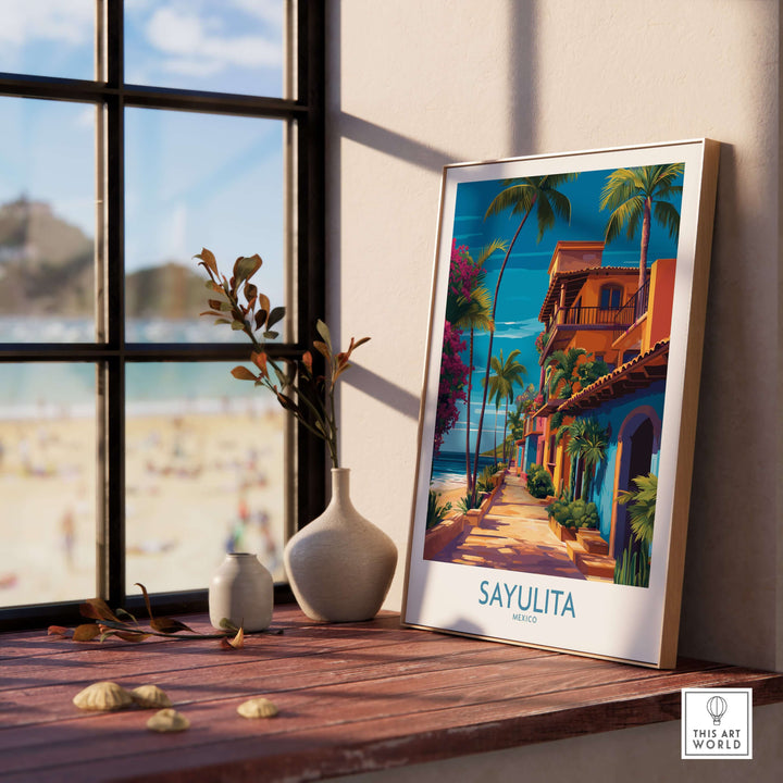Sayulita Mexico Colorful Street Art Print | Tropical Beach Town Poster framed on a wooden table with beach view.