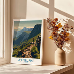Scafell Pike Lake District Canvas Print | Hiker & Highland Scene Poster on display by a window with flowers.