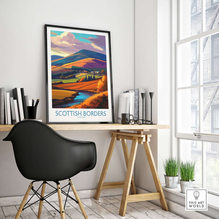 Scottish Borders autumn landscape print hanging in a stylish office setting with a desk and chair.