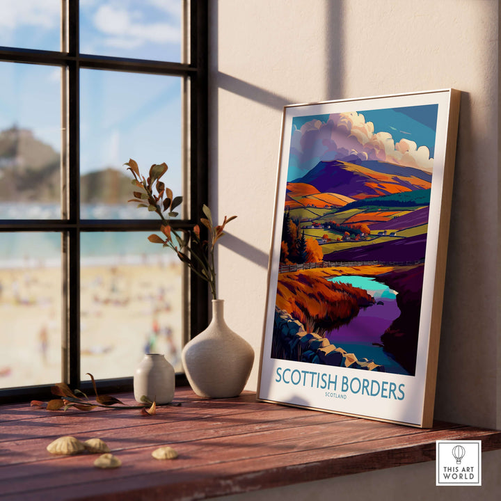 Scottish Borders travel poster with vibrant autumn hills and tranquil waters, displayed in a sunlit room.