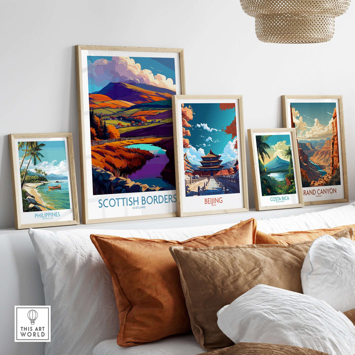 Scottish Borders travel poster amidst other vibrant landscape prints, showcasing autumn hills and tranquil scenes.