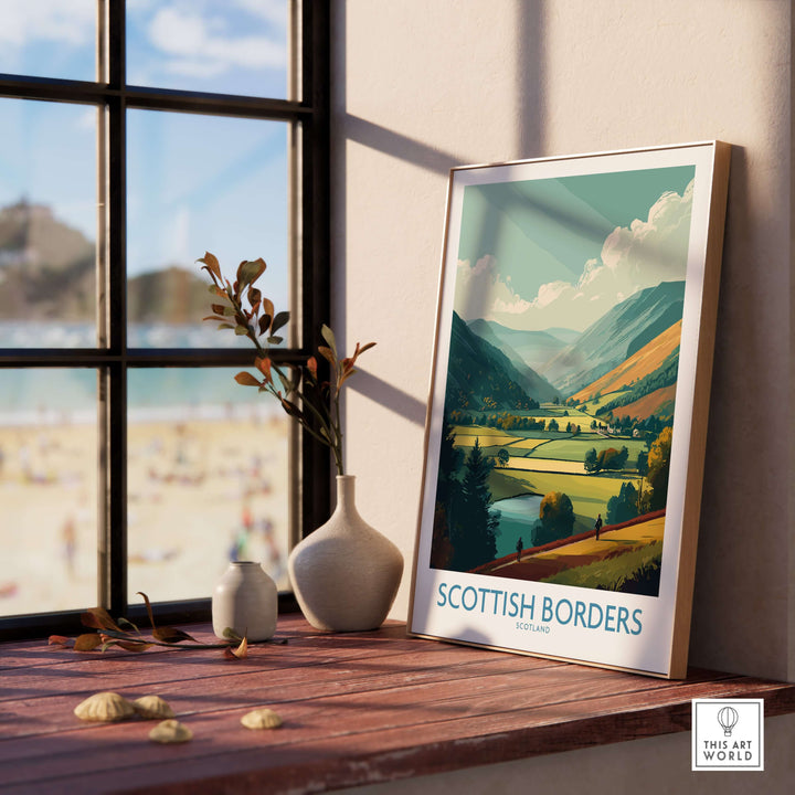 Framed travel poster of the Scottish Borders showcasing a vibrant landscape with mountains and a lush valley.
