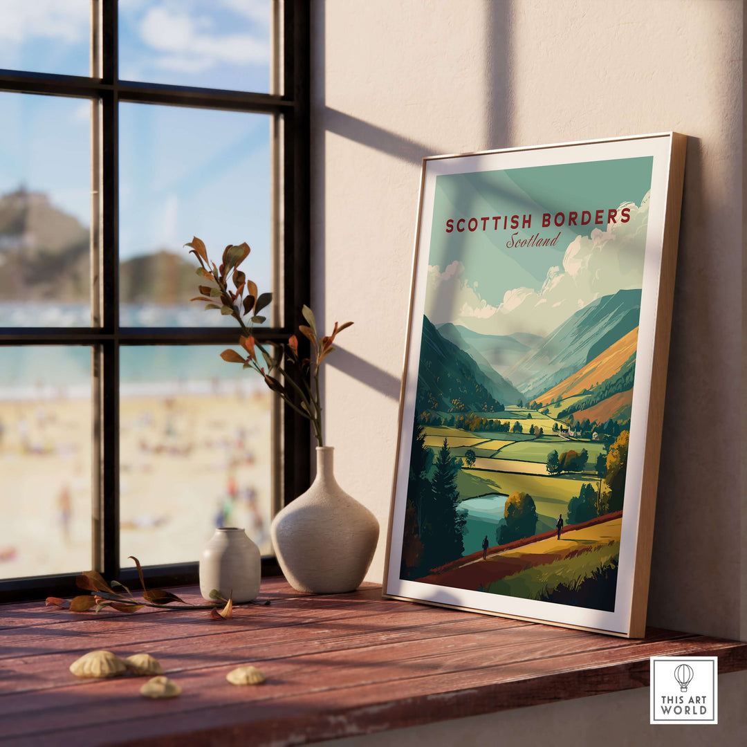 Scottish Borders landscape poster framed on a table, showcasing a panoramic valley view in Scotland.