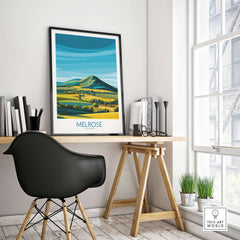 Scottish Borders Melrose Travel Print Eildon Hills Poster Modern Landscape Art framed on a desk in a contemporary workspace.