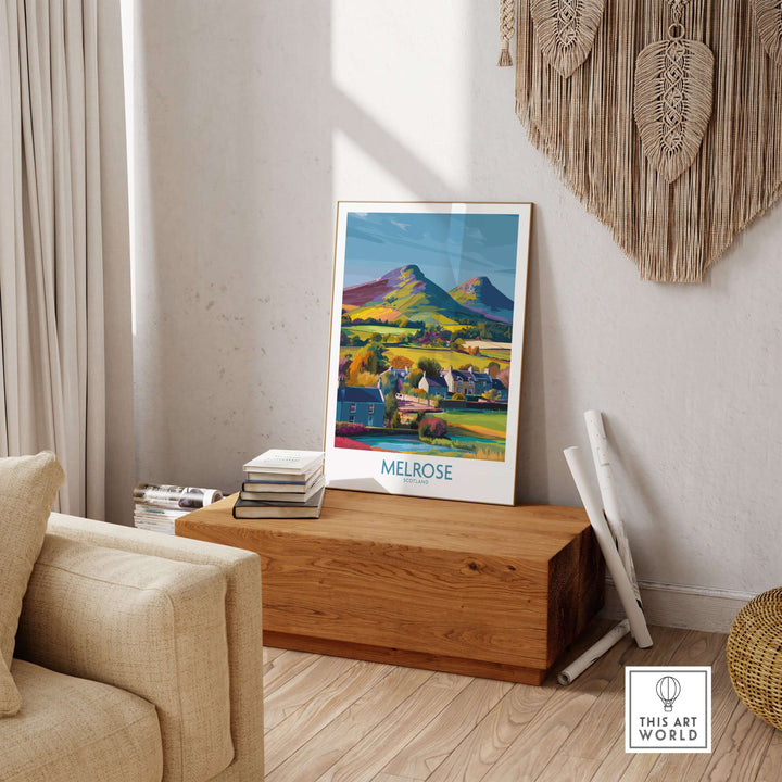 Scottish Borders Melrose village travel poster with Eildon Hills, colorful wall art in a cozy living room setting.