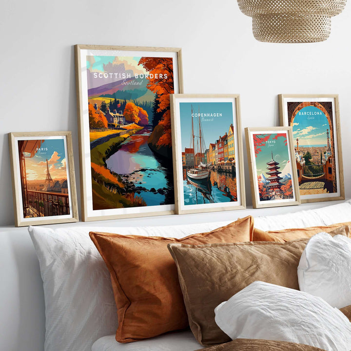 Collection of framed travel prints including Scottish Borders river scene and cityscapes from Copenhagen and Barcelona.