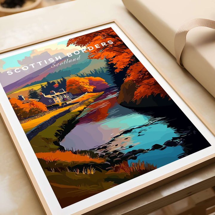 Scottish Borders river scene travel print with autumn trees in vibrant colors, showcasing a stone house and tranquil water.