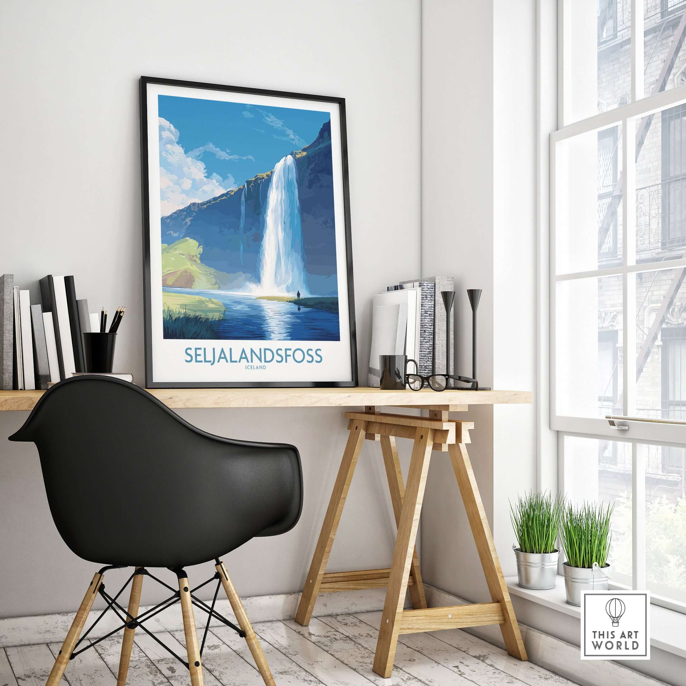 Seljalandsfoss Iceland Art Print displayed in a modern workspace, featuring a vibrant illustration of the majestic waterfall.